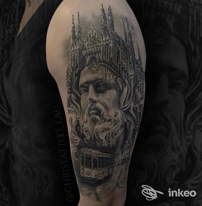 Tatuaggio realistico in bianco e nero su avambraccio sinistro, raffigurante una figura con cappuccio e una cattedrale gotica sullo sfondo, realizzato da House of Ink.