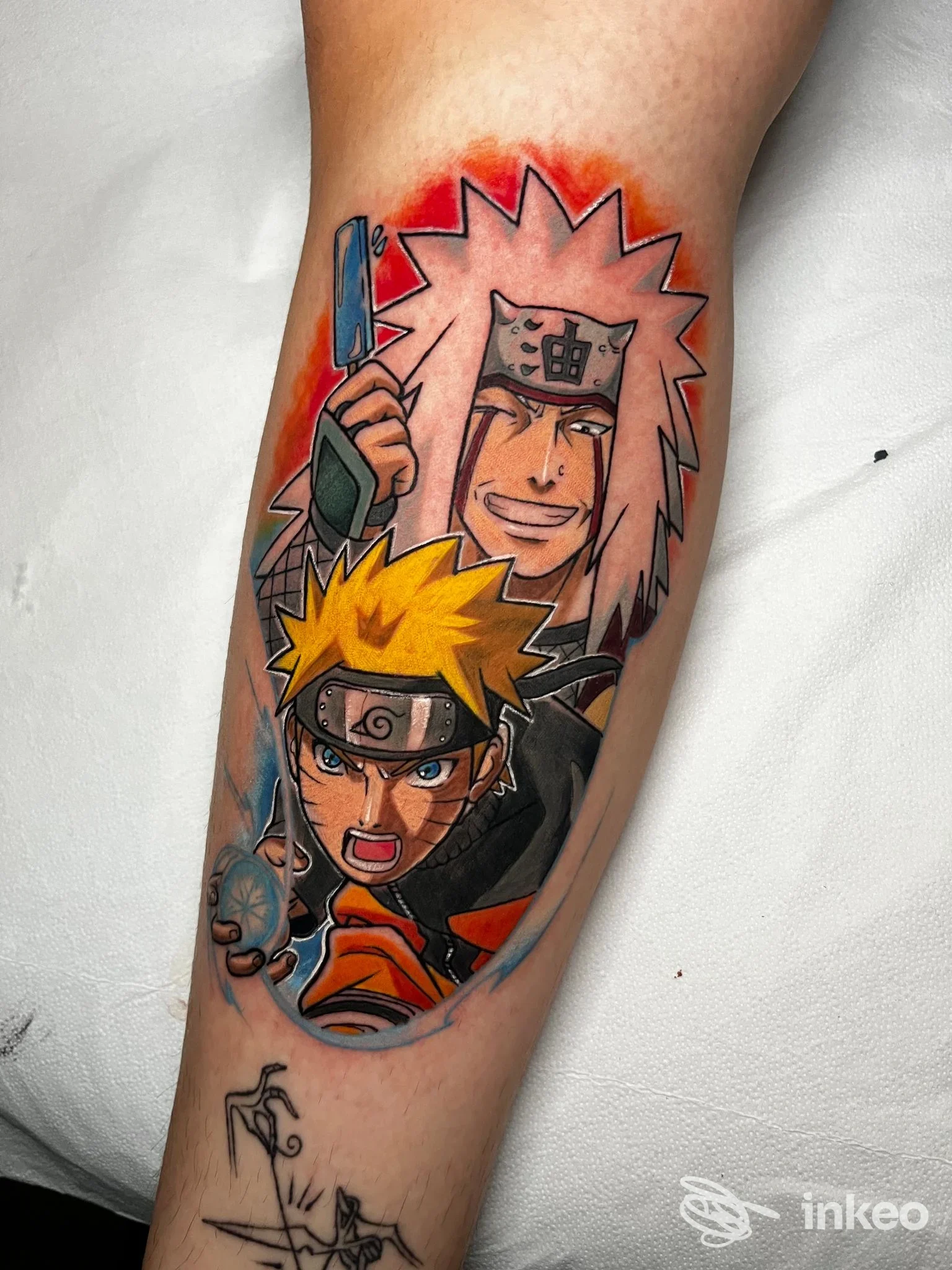 Tattoo a colori su avambraccio raffigurante Naruto e Pain di Naruto, con linee nette e riempimenti cromatici, su pelle reale.