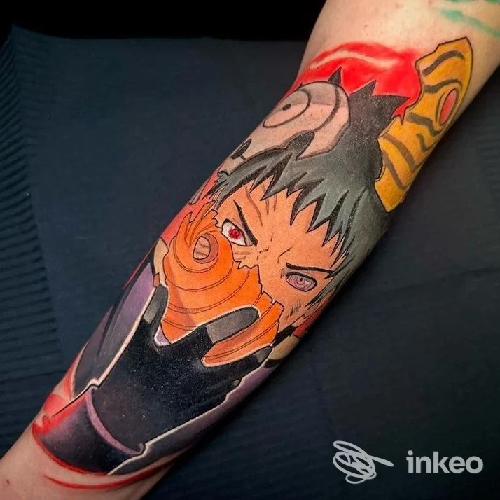 Tattoo colorato su avambraccio raffigurante personaggio anime Naruto, realizzato su pelle, colori vividi e linee nette presso Inside Tattoo Shop, Alba Adriatica.