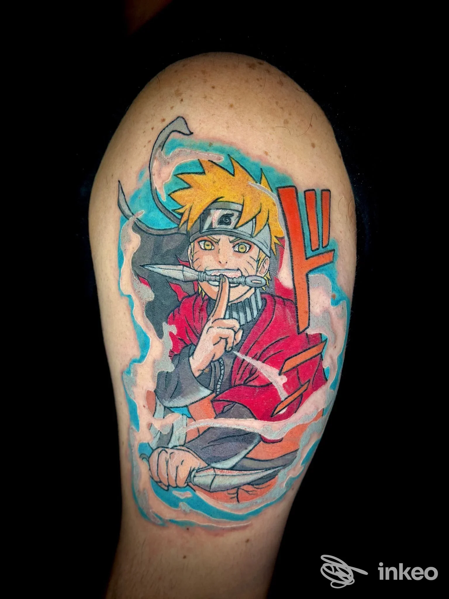 Tatuaggio a colori su braccio raffigurante un personaggio manga; immagine fornita da T'n'T Ink tattoo studio, Nepi.