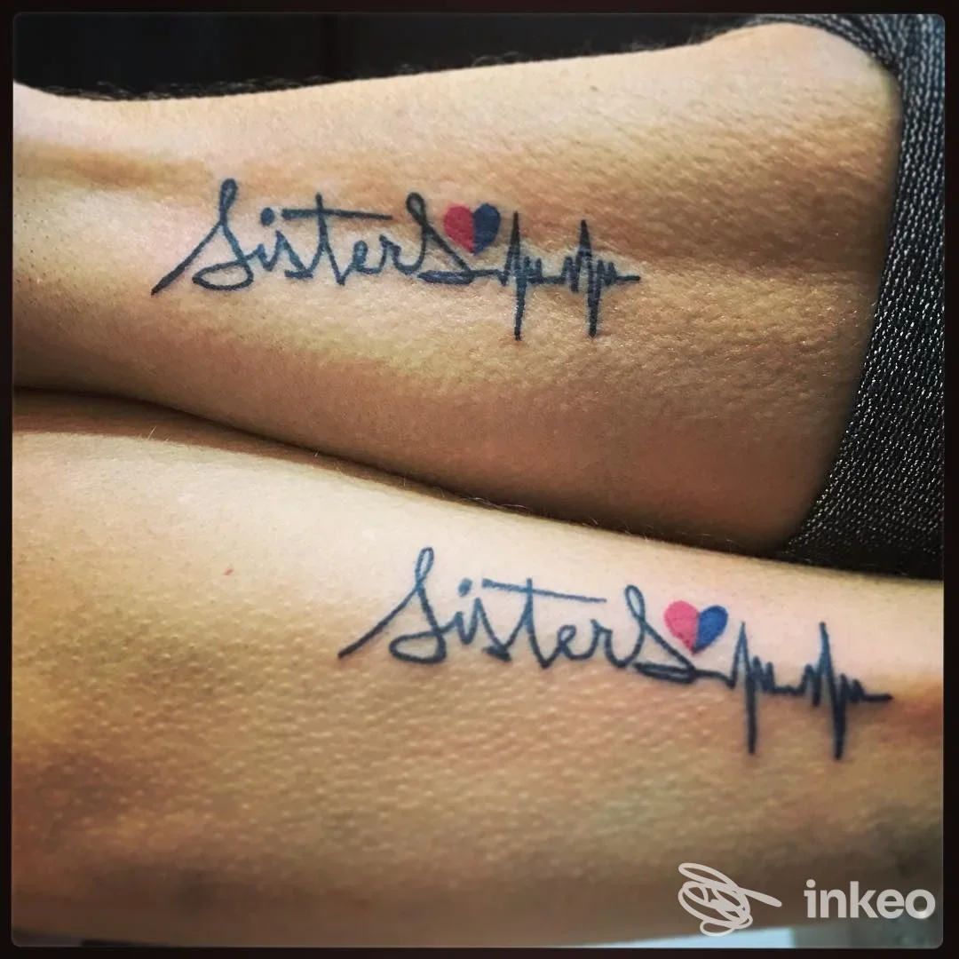 Due avambracci con tatuaggi abbinati 'Sister' con cuore e battito, realizzati da 7Monsterstattoo a Genova.