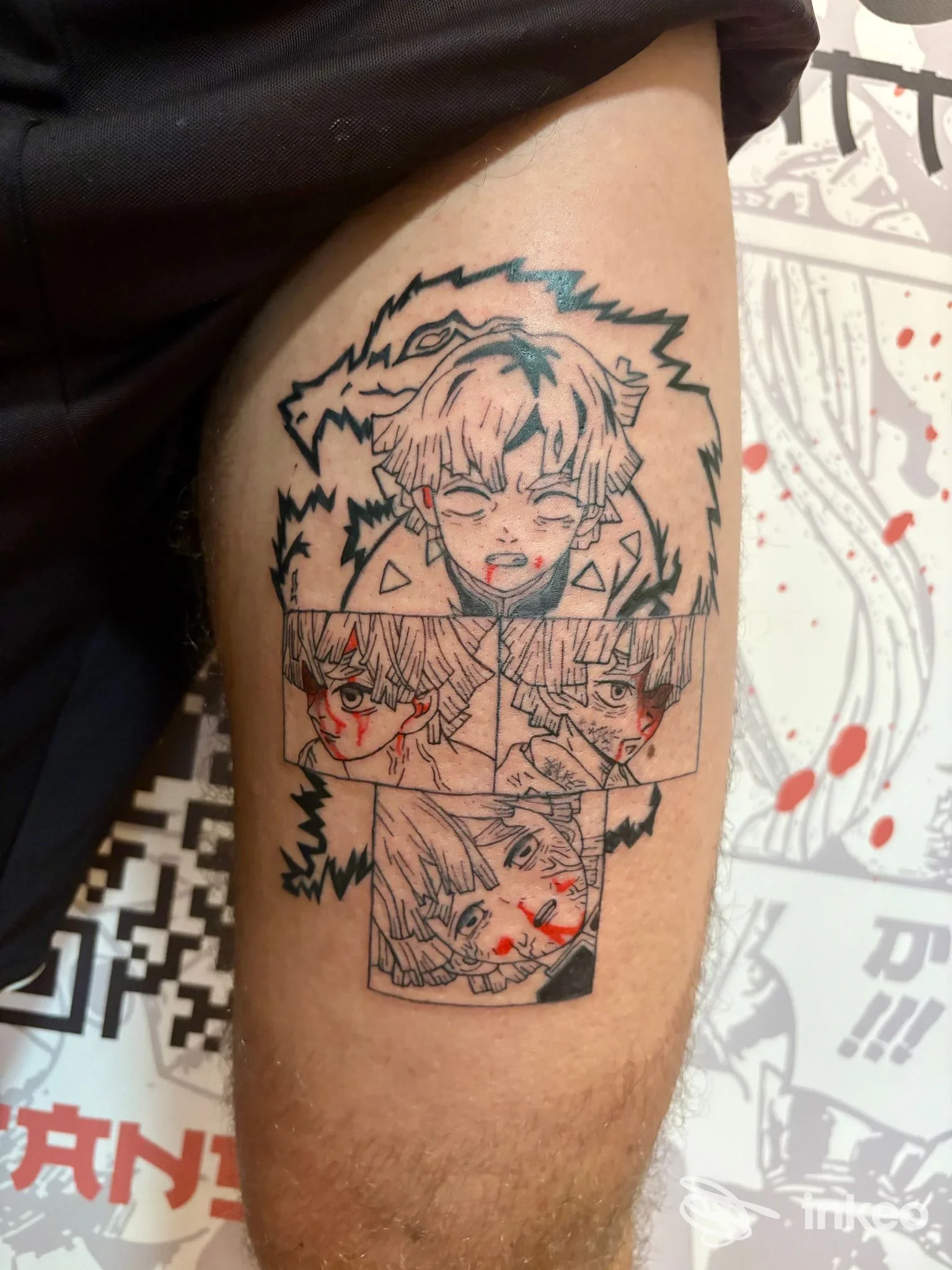 Tatuaggio stile manga su coscia, riquadri con volti e dettagli rossi. Ghoster Tattoo, Chiavari.