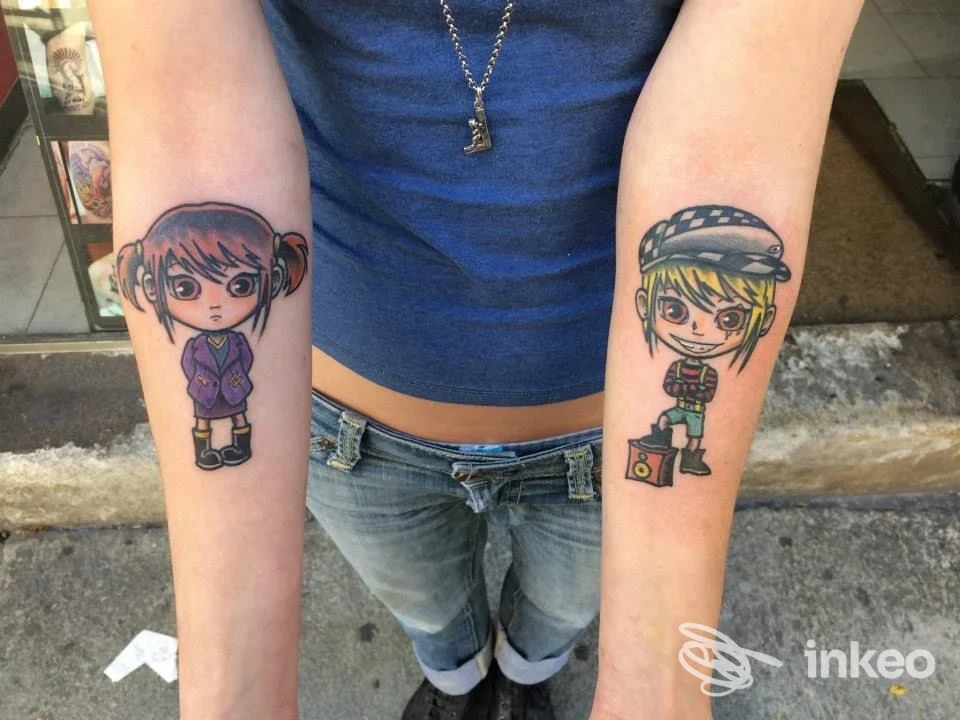 Due tatuaggi in stile cartoon sugli avambracci, foto inviata da Hard Skin Tattoo Studio, Torino.