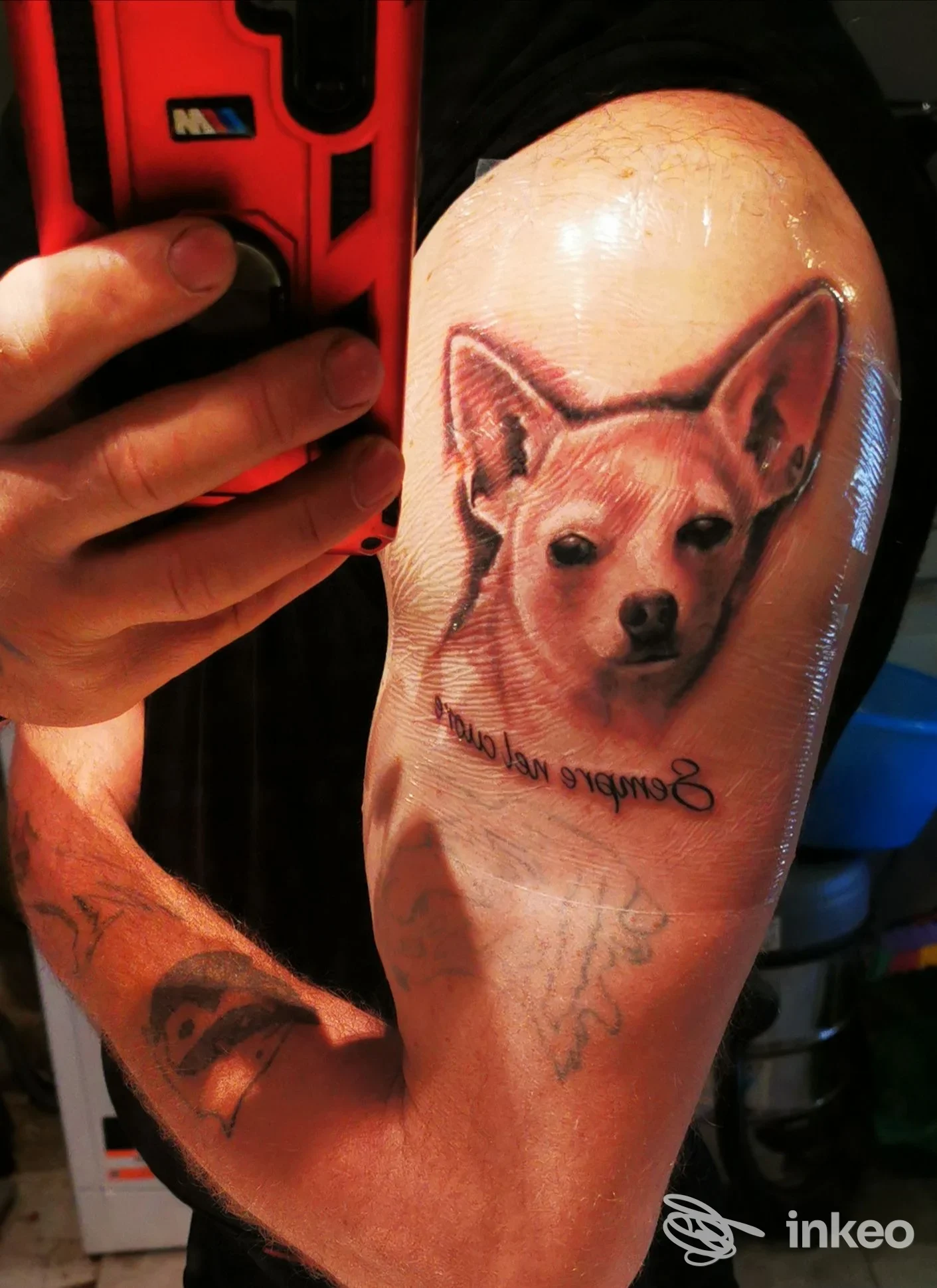 Tatuaggio realistico di un cane sul bicipite, foto inviata da Tattoo mad ink, Moncalvo.