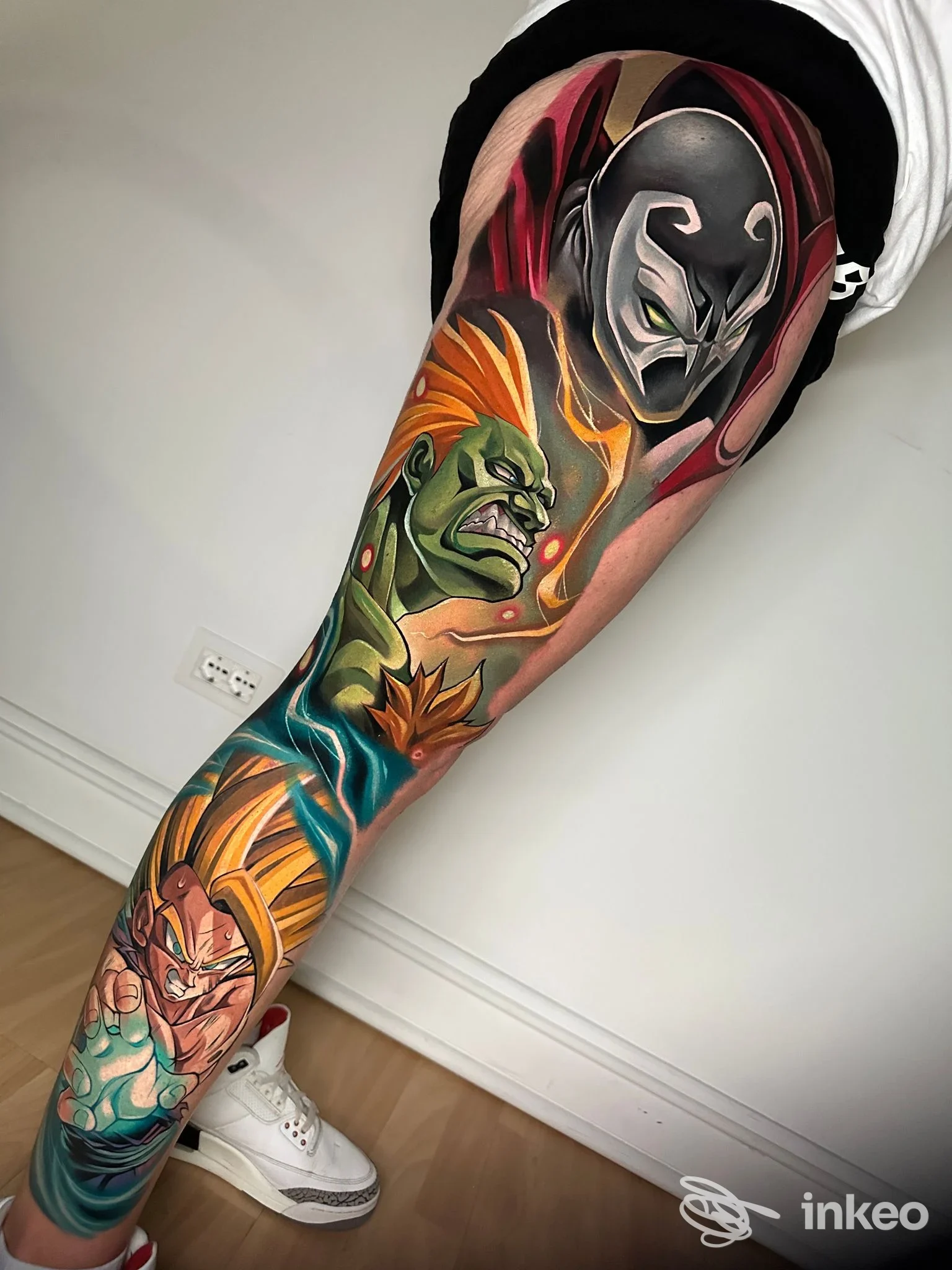 Tatuaggio a manica colorato sulla gamba realizzato da The Kingdom Tattoo Studio, Alessandria.