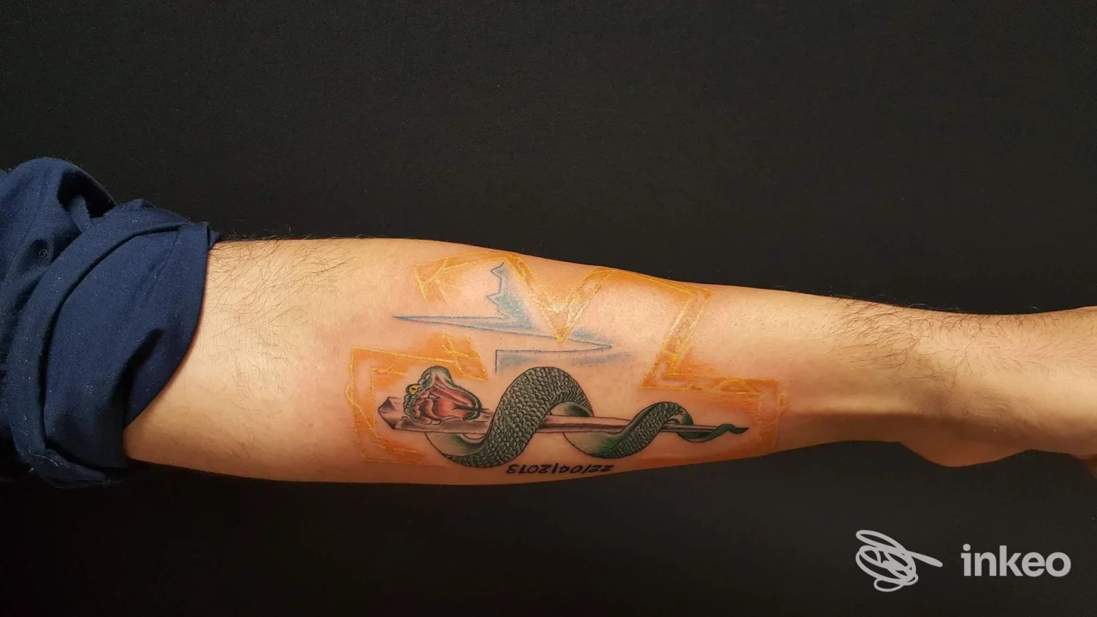 Avambraccio con tatuaggio a forma di serpente realizzato presso Studio Tatuaggi Black Ink Tattoo, Venaria Reale.