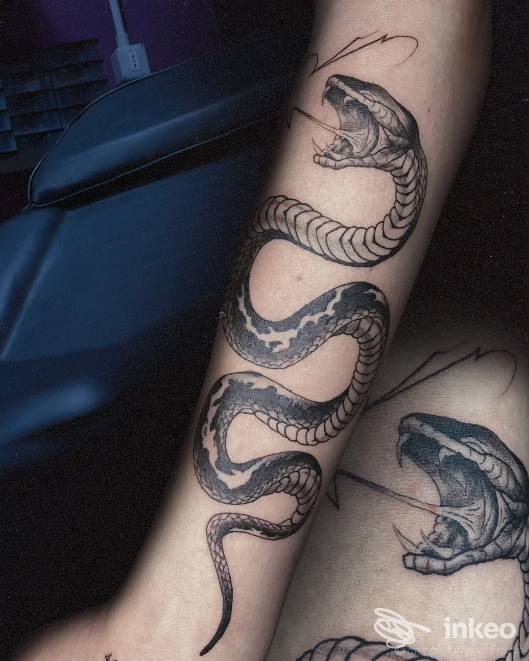 Tatuaggio a serpente sull'avambraccio, foto lavoro eseguito da Bombo Tattoo Studio a Foggia.
