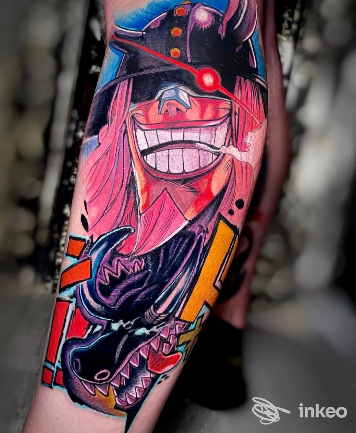 Tatuaggio colorato su avambraccio raffigurante un personaggio fumettistico e una creatura; In Cold Blood Tattoo Studio, Taranto.
