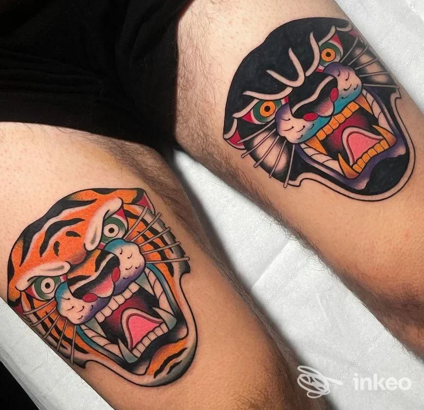 Due tatuaggi tradizionali a forma di testa di felino sulle cosce, foto dello studio Barbanera Tattoo Shop a Navacchio.