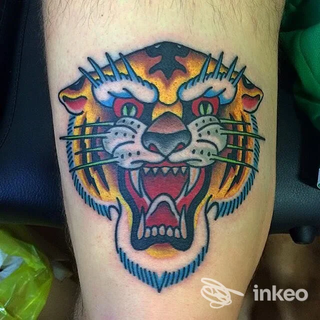 Tatuaggio a colori di una testa di tigre su avambraccio, Teschio Nero Tattoo Shop, Pistoia.