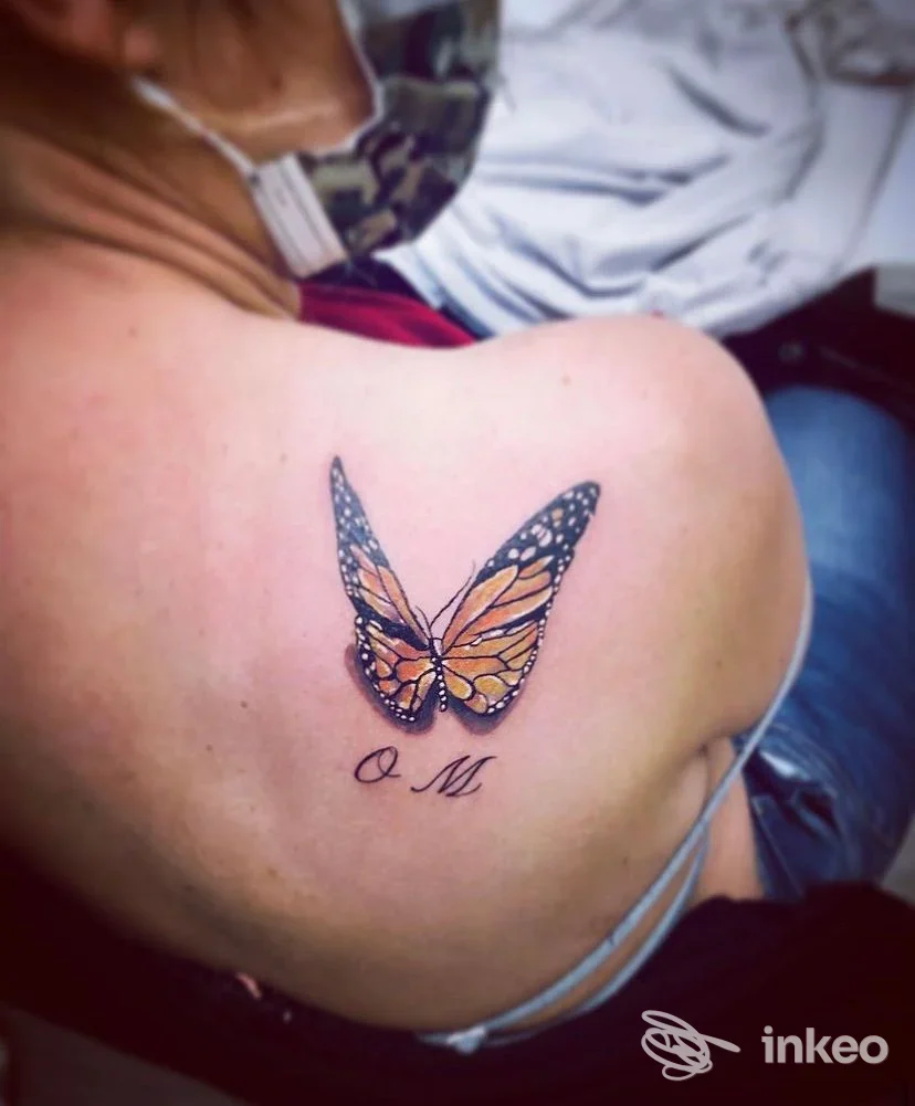 Tatuaggio a forma di farfalla colorata sulla spalla superiore, foto inviata da GELA In-k TATTOO STUDIO, Verona.