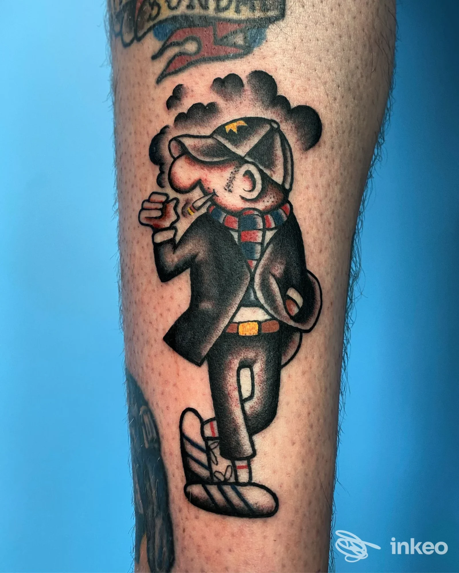 Tatuaggio cartoon colorato sul polpaccio, realizzato da Black Panda Tattoo a Bologna.
