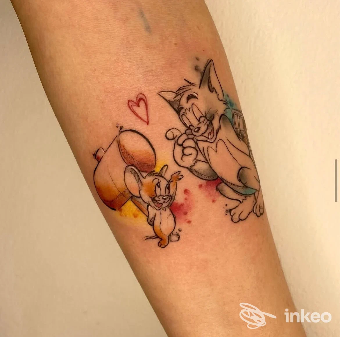 Tatuaggio su avambraccio con Tom e Jerry, realizzato da Xenia Body Art a Badia Polesine.