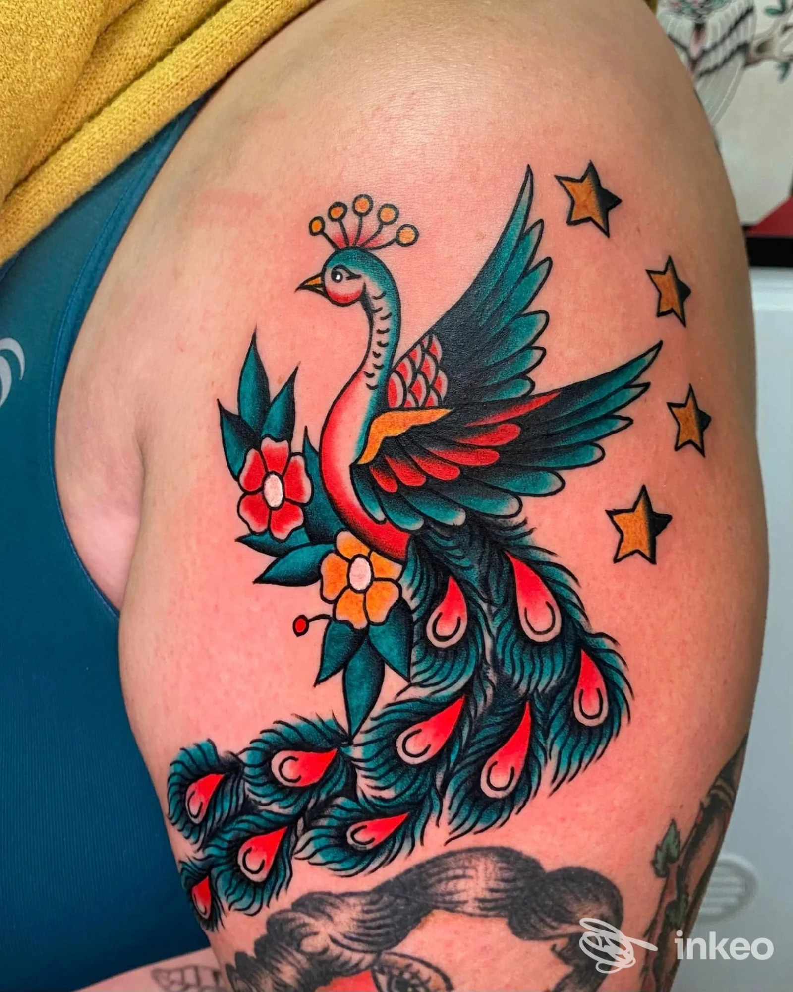 Colorato tatuaggio neo-tradizionale di fenice sul braccio/parte superiore del braccio, realizzato da DOUBLE SOUL DI BORIA GABRIELE a Jesi.