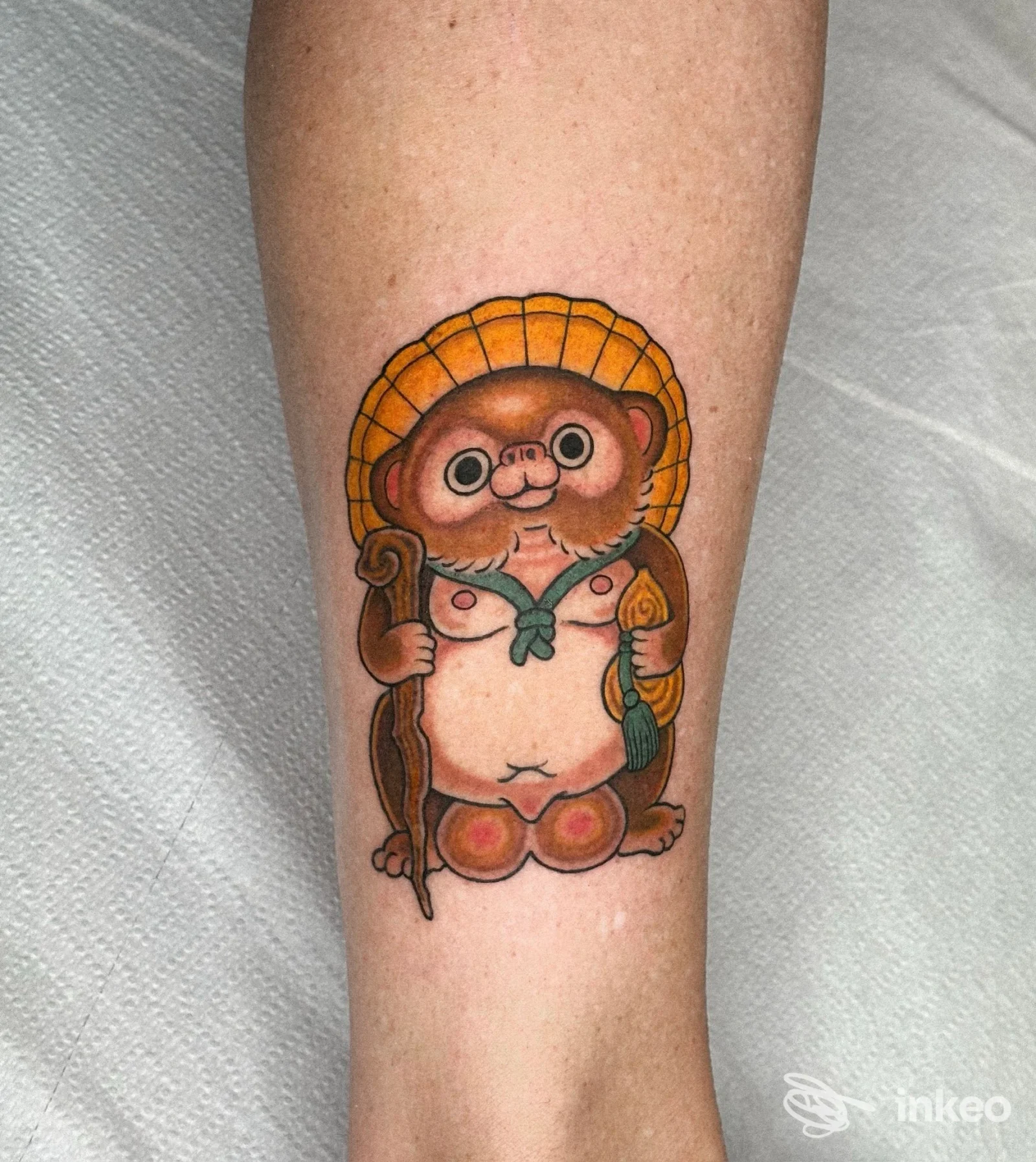 Tatuaggio colorato su avambraccio raffigurante una figura antropomorfa, immagine inviata da The White Rabbit Tattoo Studio, Villafranca di Verona.